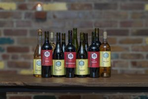 Mixed wine selection of red and white wines from the Red Brick Club at Red Brick Winery, inspired by Napa Valley.